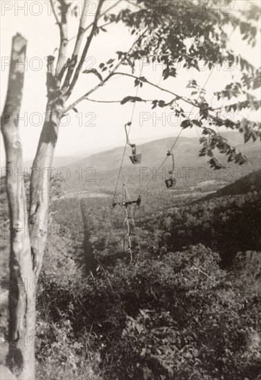 Transporting iron ore in Baba Budan Giri hills. A ropeway system transports iron ore down the forested hills of the Baba Budan Giri mountain range. Chikmagalur, Mysore State (Chikkamagaluru, Karnataka), India, 1937., Karnataka, India, Southern Asia, Asia.