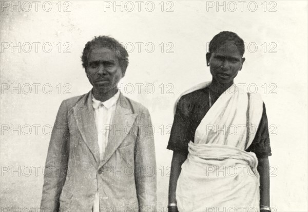 Methodist priest and his wife. Half-length portrait of a Methodist priest and his wife posing outside a church at 'Doopadcool Estate'. Mysore State (Karnataka), India, 1938., Karnataka, India, Southern Asia, Asia.