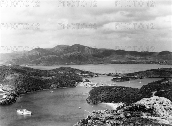 English Harbour and the Antiguan coastline. The settlement of English Harbour lies at the centre of a number of small inlets and bays on the Antiguan coastline. English Harbour, Antigua, 1965. English Harbour, St Paul (Antigua and Barbuda), Antigua and Barbuda, Caribbean, North America .