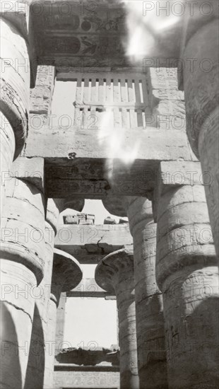 Columns of the Great Hypostyle Hall. Upward view of several stone columns of the Great Hypostyle Hall, located within the Karnak Temple complex. Karnak, Egypt, February 1945., Qina, Egypt, Northern Africa, Africa.