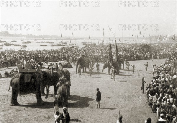 Procession route to the Triveni Sangam. Thousands of Hindu pilgrims at the Ardh Kumbh Mela are held back by ropes to make way for a procession to the Triveni Sangam (the holy confluence of the Yamuna, Saraswati and Ganges Rivers). Allahabad, United Provinces (Uttar Pradesh), India, January 1936. Allahabad, Uttar Pradesh, India, Southern Asia, Asia.