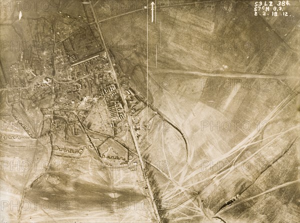 Aerial view of Sapignies, 1917. One of a series of British aerial reconnaissance photographs recording the positions of trenches on the Western Front during the First World War. Square-toothed trenches surround the bomb-damaged village of Sapignies, which is intersected by an old roman road. Sapignies, Nord-Pas de Calais, France, 2 February 1918. Sapignies, Nord-Pas de Calais, France, Western Europe, Europe .