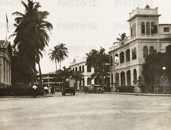 A city street in Cristobal. View along a city street in Cristobal, flanked by grand colonial-style buildings. Cristobal, Panama, circa 1930. Cristobal, Colon, Panama, Central America, North America .