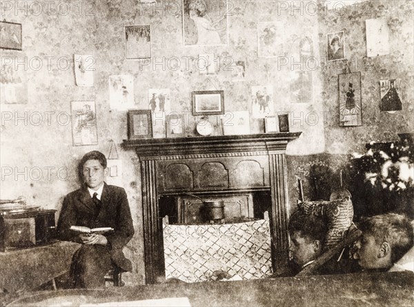 Inside a study room at Eastbourne College. Male students sit and read inside a senior study room in the boy's boarding house at Eastbourne College. Eastbourne, England, circa 1924. Eastbourne, Sussex, England (United Kingdom), Western Europe, Europe .