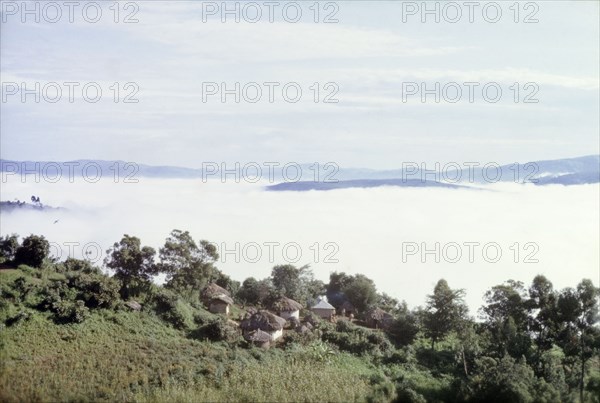 Kigezi under cloud'. Early morning view of Kigezi under cloud, taken from below Echuya Central Forest Reserve at an altitude of about 6,000 feet (1,830 metres). Kigezi, South West Uganda, September 1963., West (Uganda), Uganda, Eastern Africa, Africa.