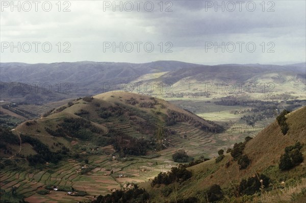 A valley in Ankole. View looking north-east across a valley in Ankole. Terraced shambas can be seen on a hillside in the foreground. Soko, West Uganda, 1963., West (Uganda), Uganda, Eastern Africa, Africa.