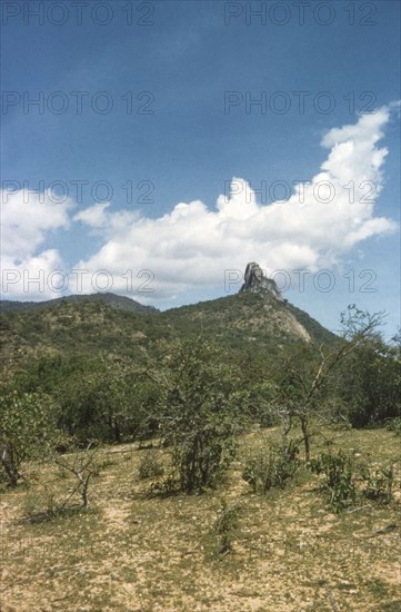 Sinjalol Peak in the Karasuk hills. Sinjalol Peak, located in the Karasuk hills on the Kenya-Uganda border. North East Uganda, May 1959., East (Uganda), Uganda, Eastern Africa, Africa.