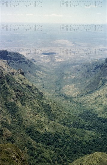 View of Tebiso from Mount Kadam. An extensive view across Tebiso and Teso, taken from the summit of Mount Kadam in Karamoja. North East Uganda, December 1958., East (Uganda), Uganda, Eastern Africa, Africa.