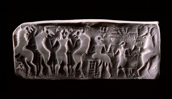 Modern impression of an early dynastic Sumerian alabaster cylinder seal