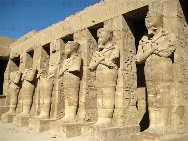 Temple of Ramses III, showing the mummy shaped sculptures of the pharaoh