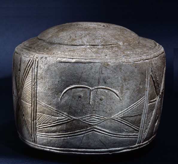 One of the three Folkton drums, found in a child burial in a round barrow excavated by William Greenwell in 1889