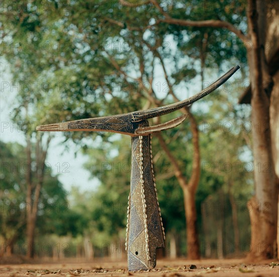 Although in the form of a gazelle these mask headdresses actually depict and are called by the name of a specific dead elder