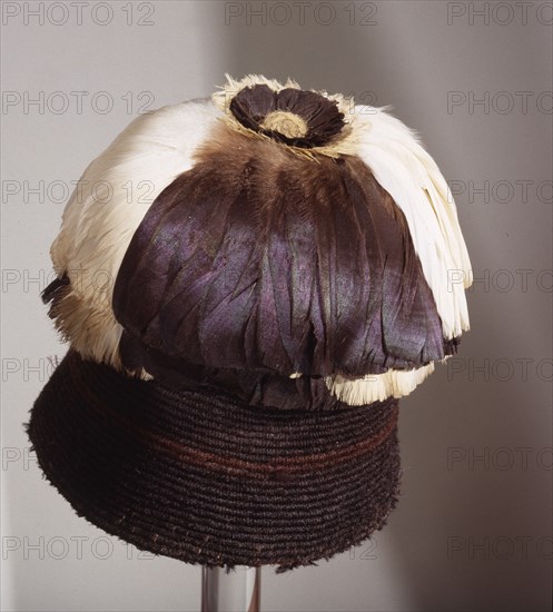 Fez style hat with feather plumes