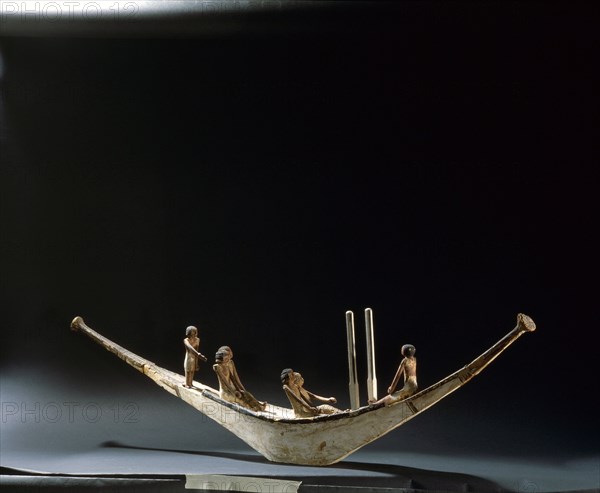 A model of a rowing boat with crew and two steering posts