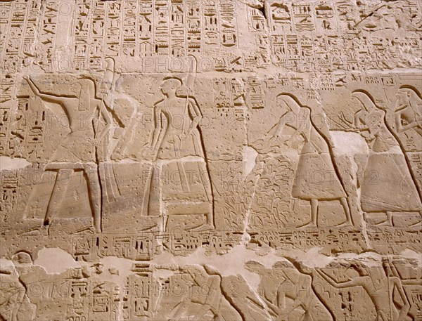 Relief depicting priests scribes and captives being presented to Ramesses III, from his mortuary temple