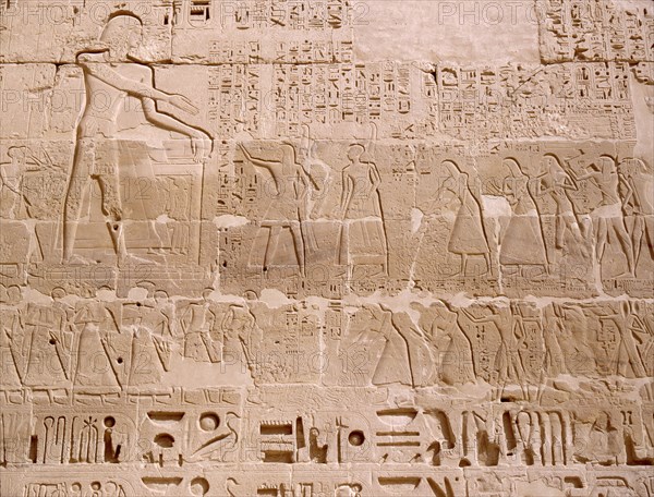 Relief depicting priests scribes and captives being presented to Ramesses III, from his mortuary temple