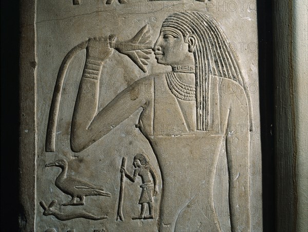 A relief on the false door of Nikaure who was a priest of the god Ra and the goddess Hathor in the sun temple of King Neferirkare