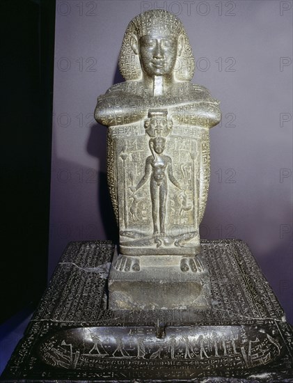 Block statue of Djedher, a fourth century official and sage, in the form of a temple guard