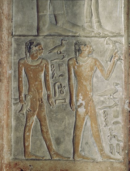 Tomb relief depicting two boys wearing the side lock of youth