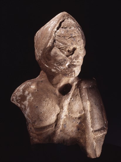 Terracotta image of a gladiator, wearing a helmet and carrying a rectangular shield