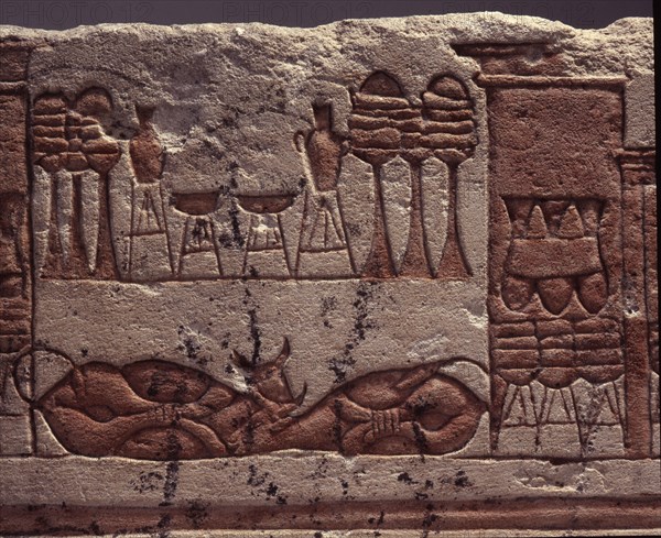 A fragment of a relief depicting animal and food offerings