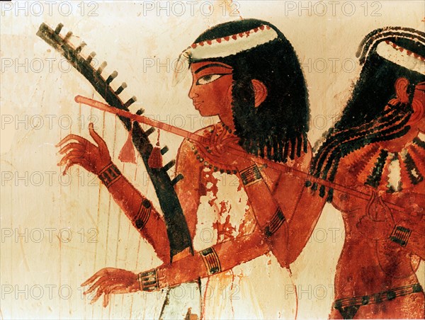 A detail of a painting from the tomb of Nakht depicting three female musicians