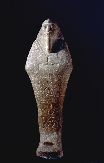 Shabti figure of King Taharqa, holding a hoe and a cord that passes over his shoulder