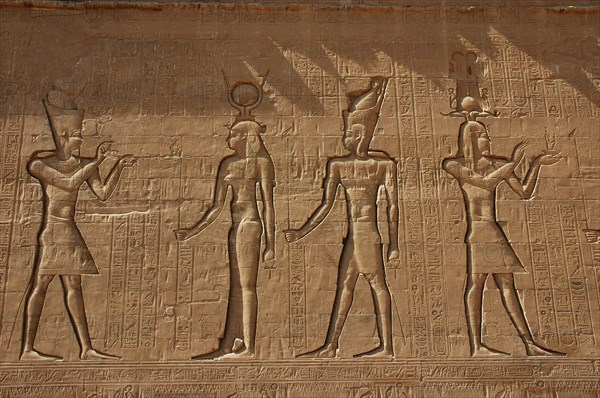 Reliefs on the outer back walls of the temple complex depicting a pharaoh burnign incense for the goddess Isis