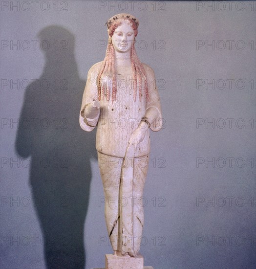 A figure of Kore with archaic smile and Ionic costume and hairstyle