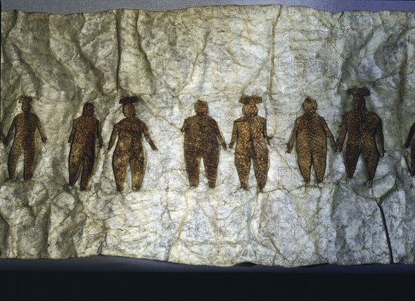 Picture made from seal gut skin with sewn on male and female figures with a umiaq (womens boat)