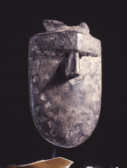 Sometimes called passport masks, these miniature masks in fact had a wide variety of functions, being used as charms, as insignia of specific ranks in the Poro society, and as proof of ownership of a full sized mask