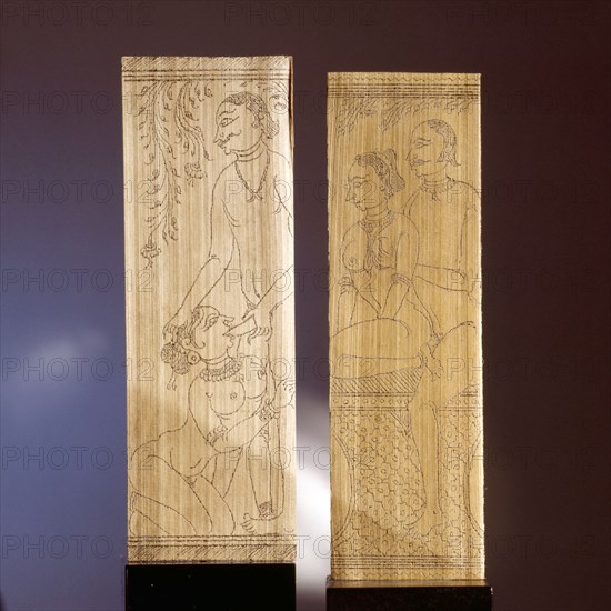 Two leaves of a palm leaf manuscript depicting erotic scenes