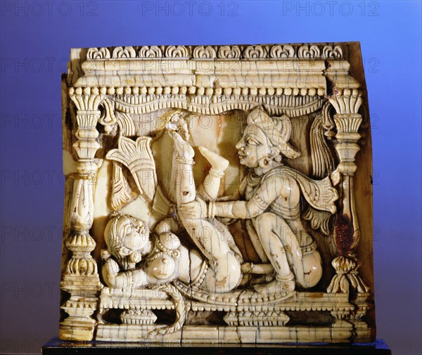 An ivory panel, probably from a bed or a swing, carved with a tantric scene of a couple making love