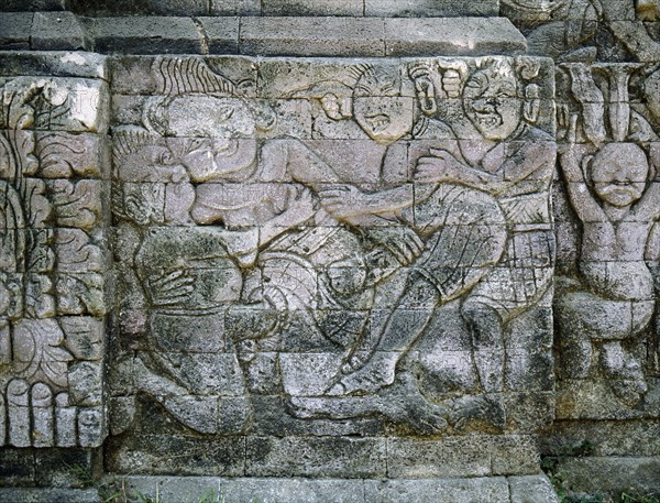 Stone relief on a temple wall at Sangsit, Buleleng