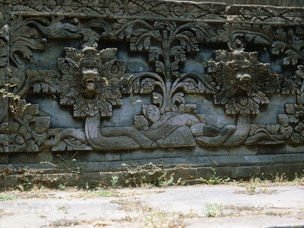 Stone relief on a temple wall at Sangsit, Buleleng