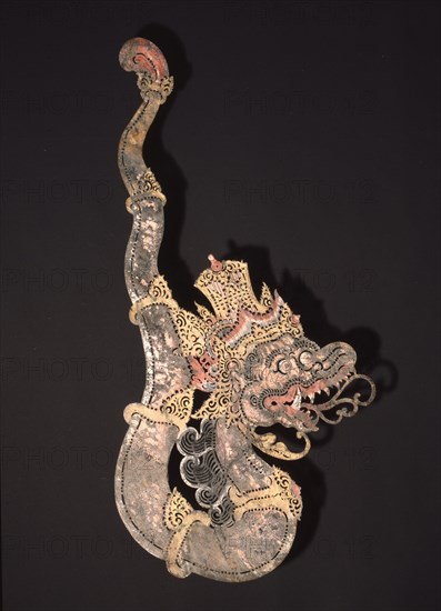 Wayang shadow puppet of the serpent Antaboga, used in popular all night performances, usually based on ancient Hindu epics such as the Ramayana