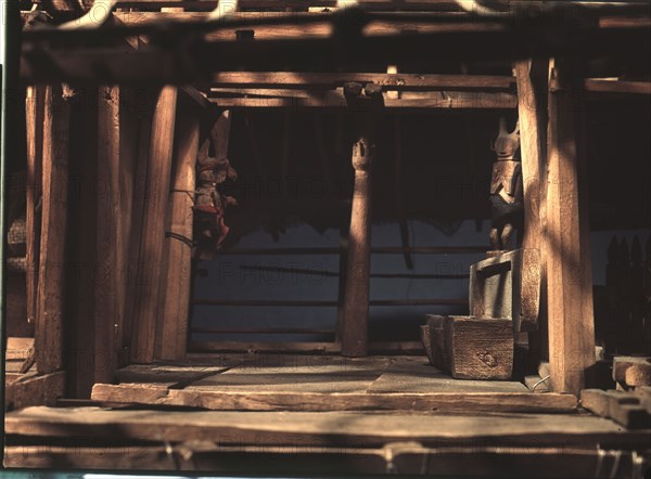 Model of a Nias spirit or ghost house, which ancestral spirits, represented by the carved figures, were expected to inhabit