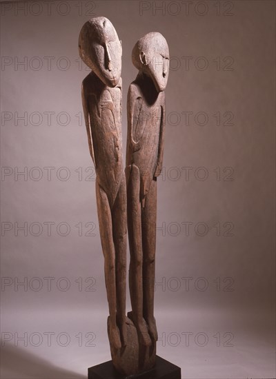 A carving depicting paired male and female clan ancestors, from a Lake Sentani mens meeting house