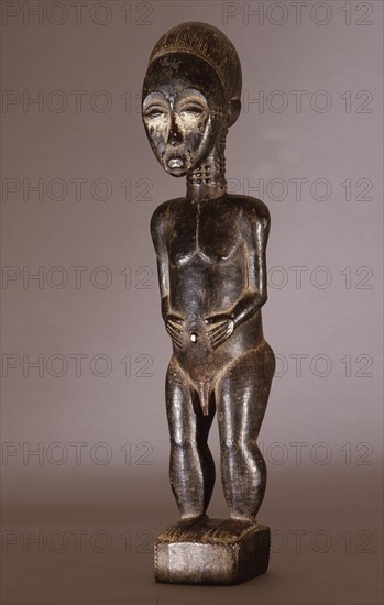 Baule figure sculpture represents either nature spirits of a spirit wife or husband