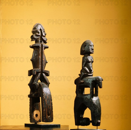 Heddle pulley used to support the cord to the foot pedals which alternate the heddles on the narrow strip loom typical of West African mens weaving