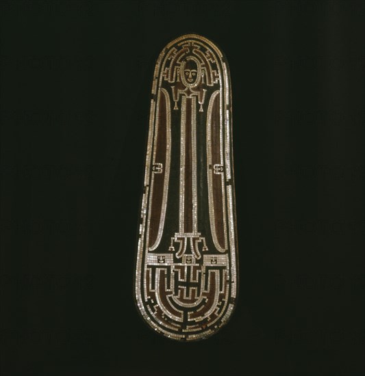 Ceremonial dance shield with a human figure outlined in inlaid sections of nautilus shell