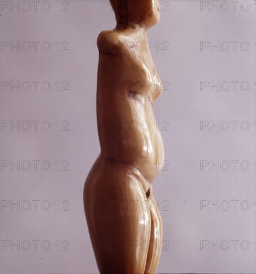 Ivory carving of a human female which was worn as a pendant