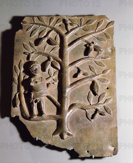 A plaque depicting a servant collecting fruit, one of many which decorated the palace of the Oba of Benin