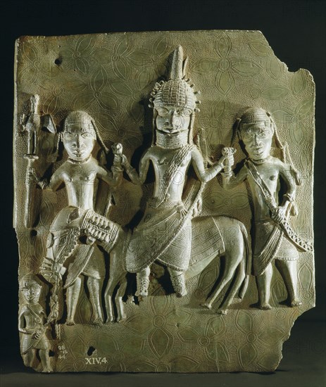 Benin brass plaque from the palace, depicting an Oba on horseback supported by two retainers