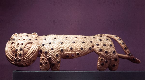 An arm ornament in the form of a leopard, part of a ceremonial outfit of the Oba of Benin