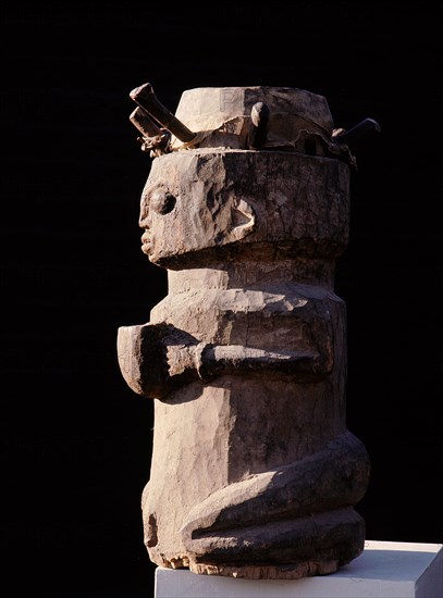 Drum in the form of a kneeling woman with an offering bowl