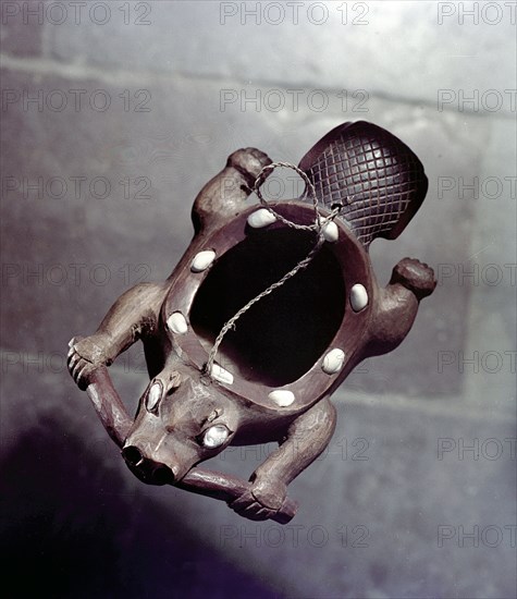 Wooden dish in the shape of a swimming beaver