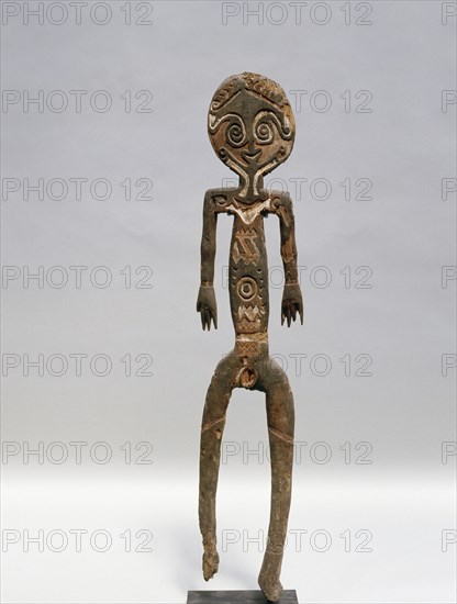 Painted two dimensional female figure incised on bark, from the Papuan Gulf area