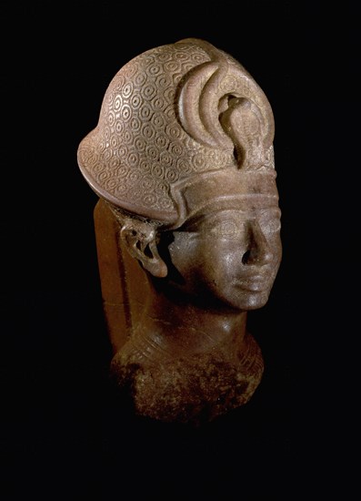 Statue depicting the Pharaoh Amenhotep III wearing the Blue Crown (khepresh)