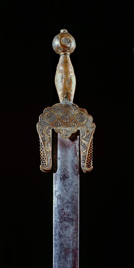 A very rare ceremonial iron sword with brass pommel